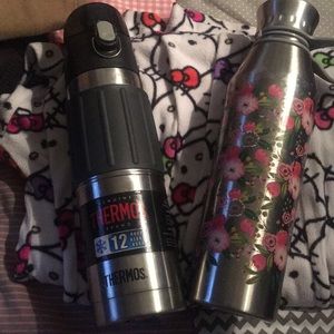 Women’s bundle of clothes and thermos